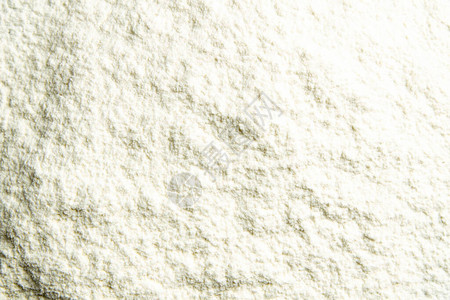 面粉特写背景一堆白色背景上的面粉洒了面粉面粉质地图片