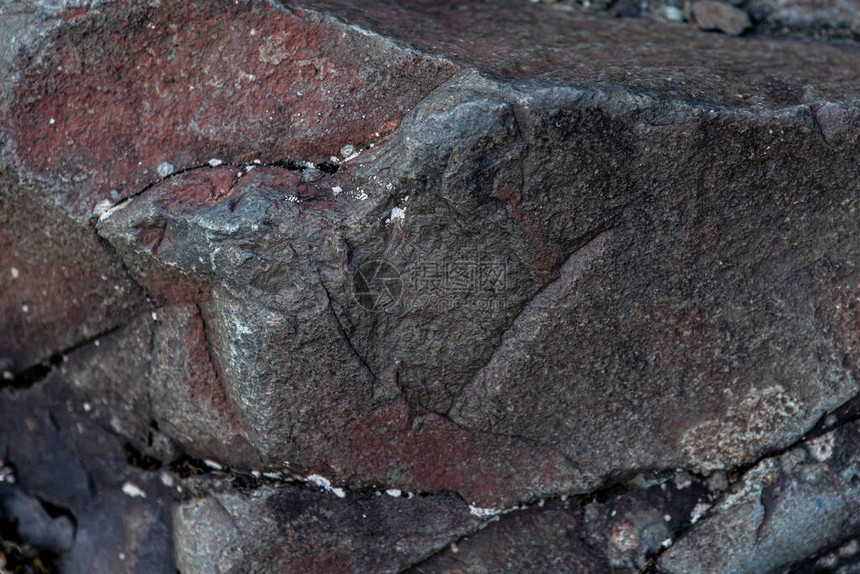 深色史前石头的纹理和背景图片