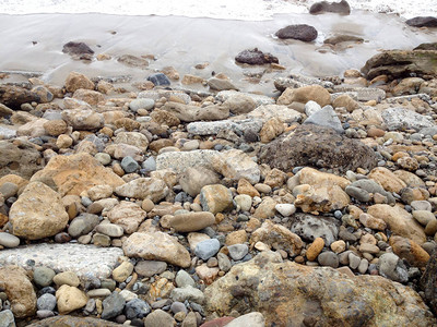 海滩冲浪海岸线沙子泡沫岩石头图片