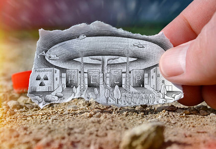 福岛建筑用帮助一词和核爆炸绘制在一张手持纸上背景图片