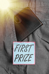 写一等奖的笔记仅提供给总冠军的最令人垂涎的奖品的商业概念靠近符号纸的裤子前背景