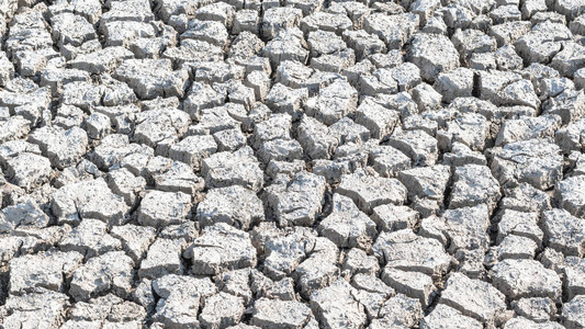 干旱无水土地裂泥干旱地面土壤的干旱和荒漠化环境背景图片