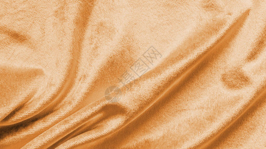 铜金丝绒背景或金黄色丝绒法兰绒质地图片