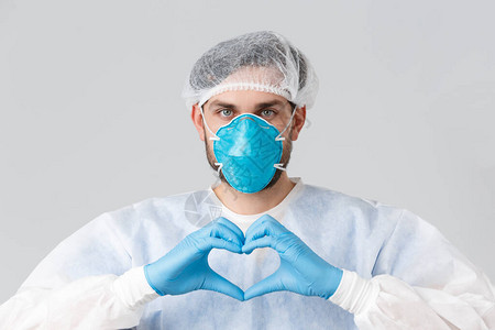 身穿个人防护设备医用呼吸器和橡胶手套的医生图片