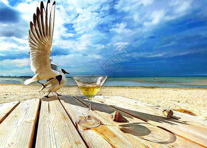 海滩度假村海景蓝天海水阳光明媚的日子放松休闲背景的木桌上的图片