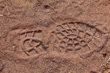 跨曼提凯拉地上的脚步花纹人迹背景