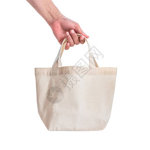 手提袋帆布白色棉织物布生态肩购物袋样机空白模板隔离在粉红色背景图片