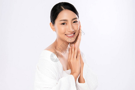 美丽的脸微笑的亚洲女人触摸健康的皮肤肖像美丽的快乐女孩模型图片