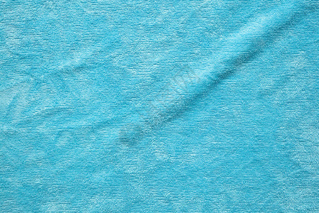 蓝色毛巾织物纹理表面特写背景图片