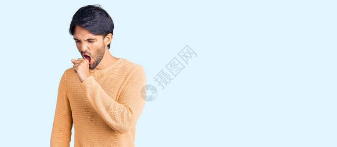 身穿散装毛衣不舒服咳嗽等感冒或支气管炎症状的英俊男图片