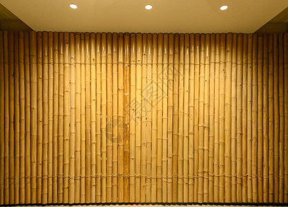 竹子舞台背景墙壁上装饰的黄竹木的背景和纹理图片
