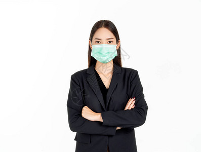 一位自信美丽的年轻亚洲女商人戴着绿色医用面罩和黑色西装图片