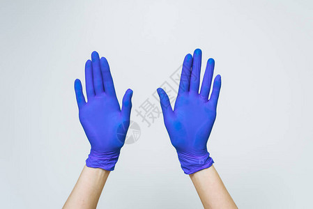蓝拉克思医生手套女五指符号和蓝色背背景图片