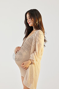 怀孕女士年轻的美女孕照写真背景
