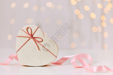 浅粉蝴蝶结丝带情人节礼物盒背景