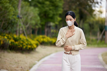 女性呼吸困难捂胸口背景图片