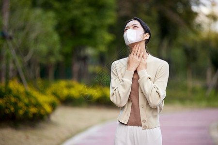 女性呼吸困难捂喉咙背景图片