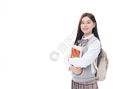 抱着书本微笑的女学生图片