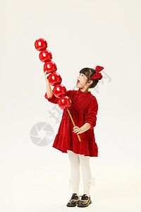 中国风小女孩手拿大糖葫芦形象背景图片