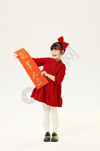 春节汉服兔年身穿红衣的小女孩双手拿春联背景