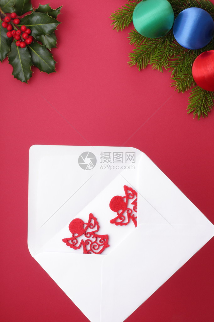 红色的信封和天使的圣诞问候图片