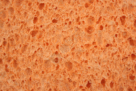 橙色海绵纹理背景图片