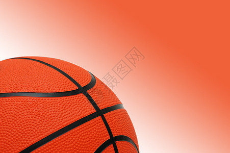 渐变橙色背景上的篮球图片