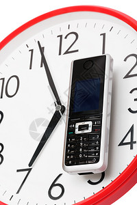 时钟表盘上的现代电话图片