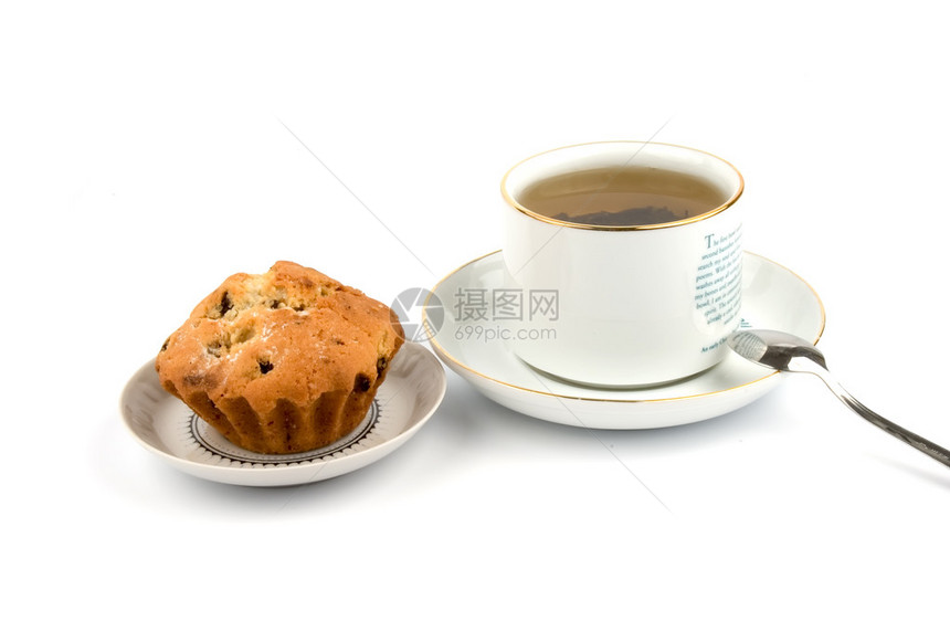 茶碟上的一杯茶和蛋糕图片