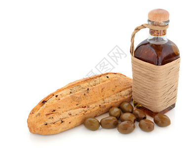 橄榄面包和橄榄与瓶橄榄油包裹在酒椰叶分图片