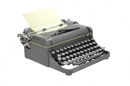 黑色破旧的老式打字机隔离在白色背景图片