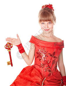 红色的长礼服举行圣诞钥匙的孩子图片