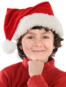 可爱的男孩戴着圣诞红帽子在图片