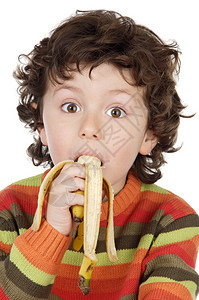 吃黄色香蕉的可爱孩子图片