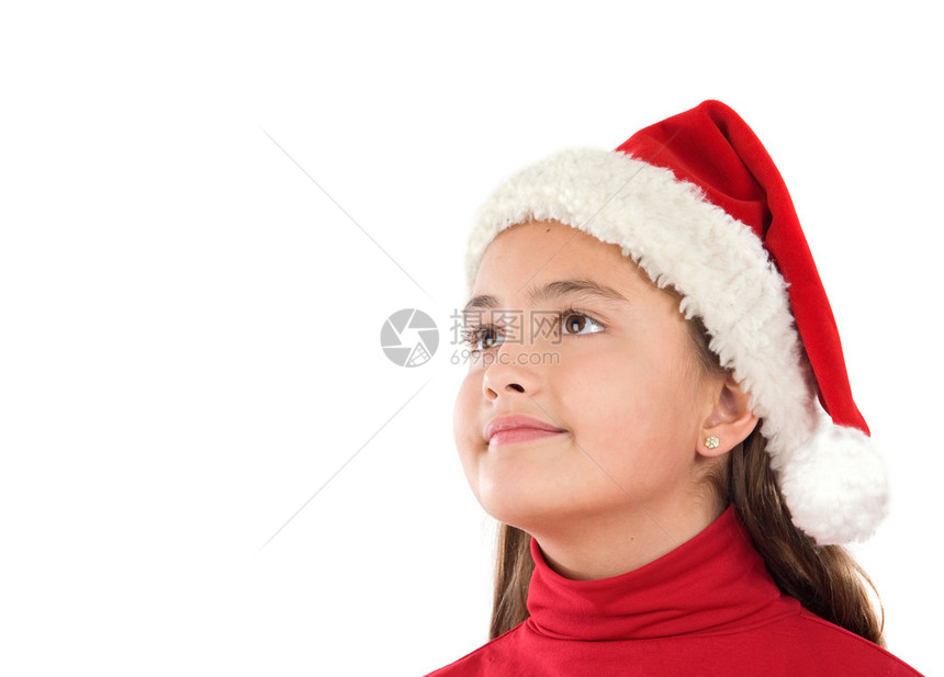 美丽的女孩戴着圣诞帽子在白之图片