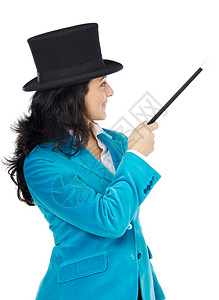 有魔法杖和白面帽子的有吸引力的女商图片