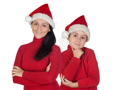 带着圣诞帽子的母亲和儿子被隔离在图片