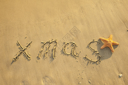 圣诞节手写在海滩图片