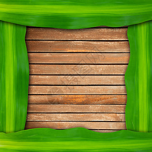 木质背景上的绿叶框架图片