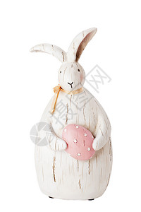复活节兔子与鸡蛋雕像在白色图片