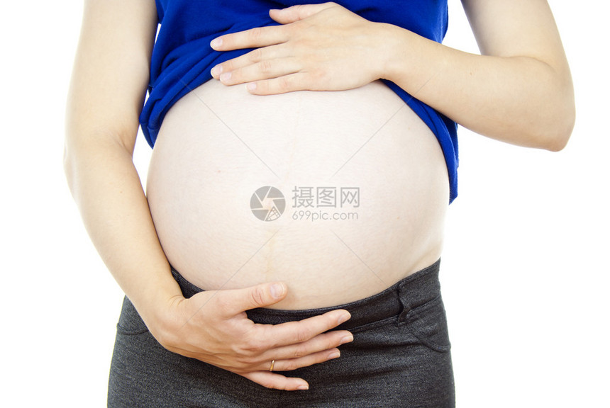 孕妇轻抚摸她的肚子图片