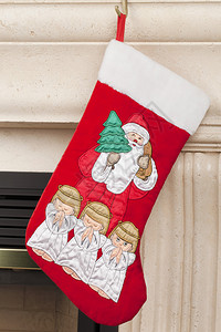 圣诞丝袜贴近镜头与圣诞老人父亲和祈祷的图片