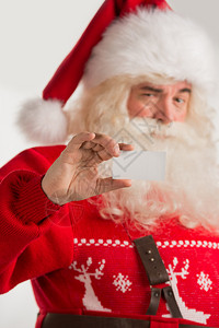 快乐的圣诞老人的肖像显示空白名片图片