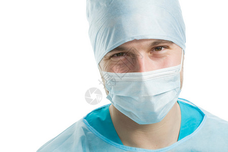 年轻外科医生戴白脸面罩的图片