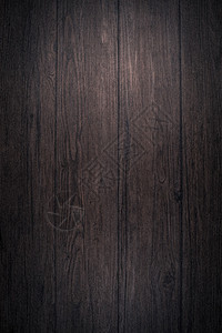 深棕色木材纹理背景的特写细节图片