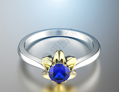 配有蓝宝石的黄金订婚戒指图片