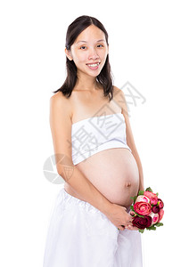 孕妇拿着花图片
