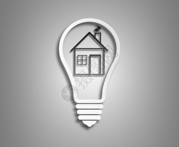 电灯泡和里面的房子作为绿色能源的象征概念生态浅色背景图片