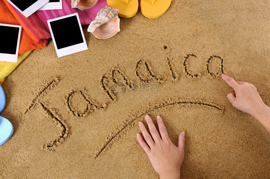 儿童用毛巾翻滚图和空白照片指纹在沙子上写牙买加字Studioshot方向光和颜图片