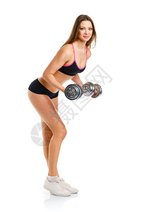 有哑铃的美丽运动女运动员在进行运动锻炼图片